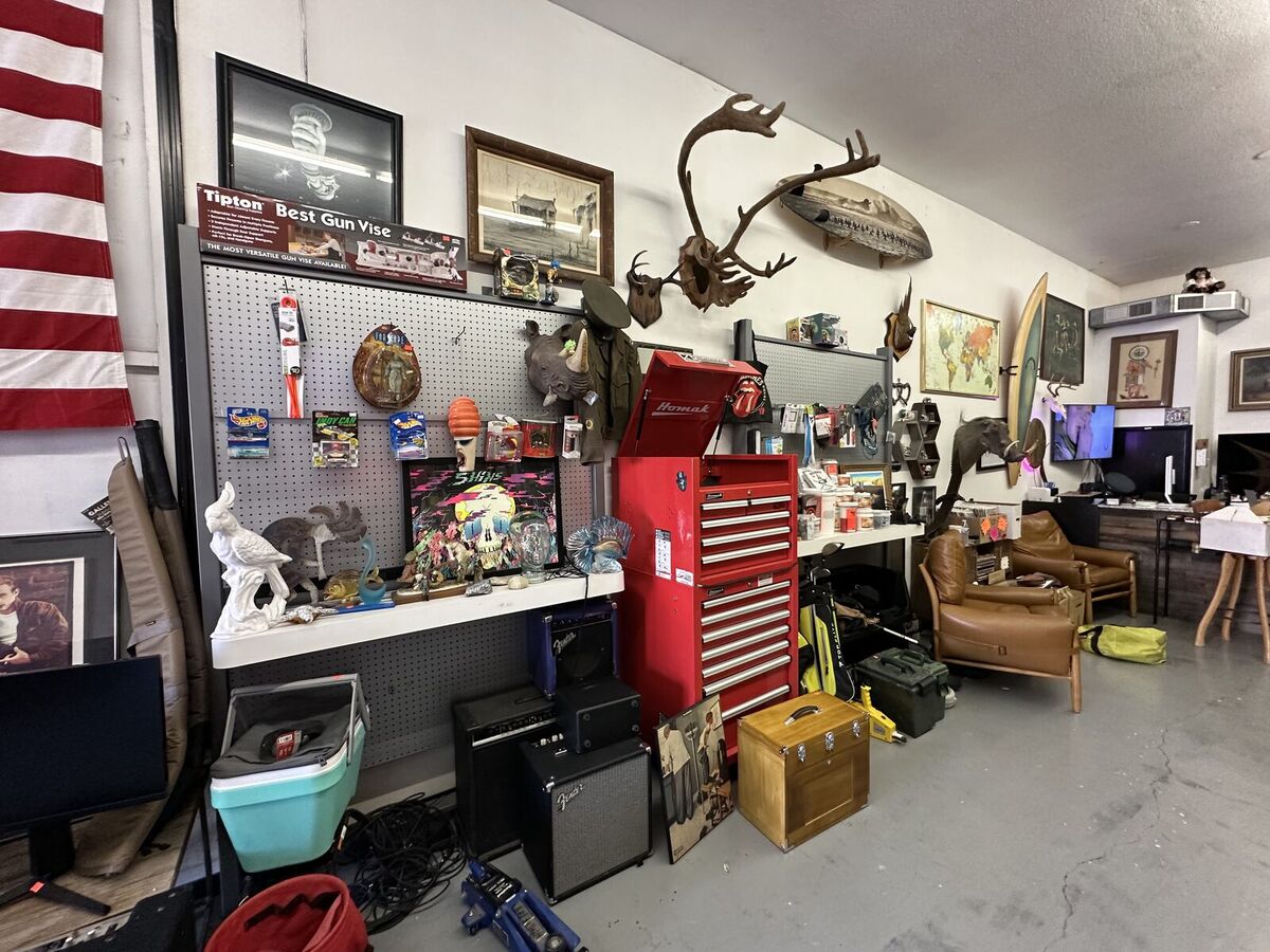 Inside Legacy: tool chests, amps, sports collectibles, and mounts on the shop floor